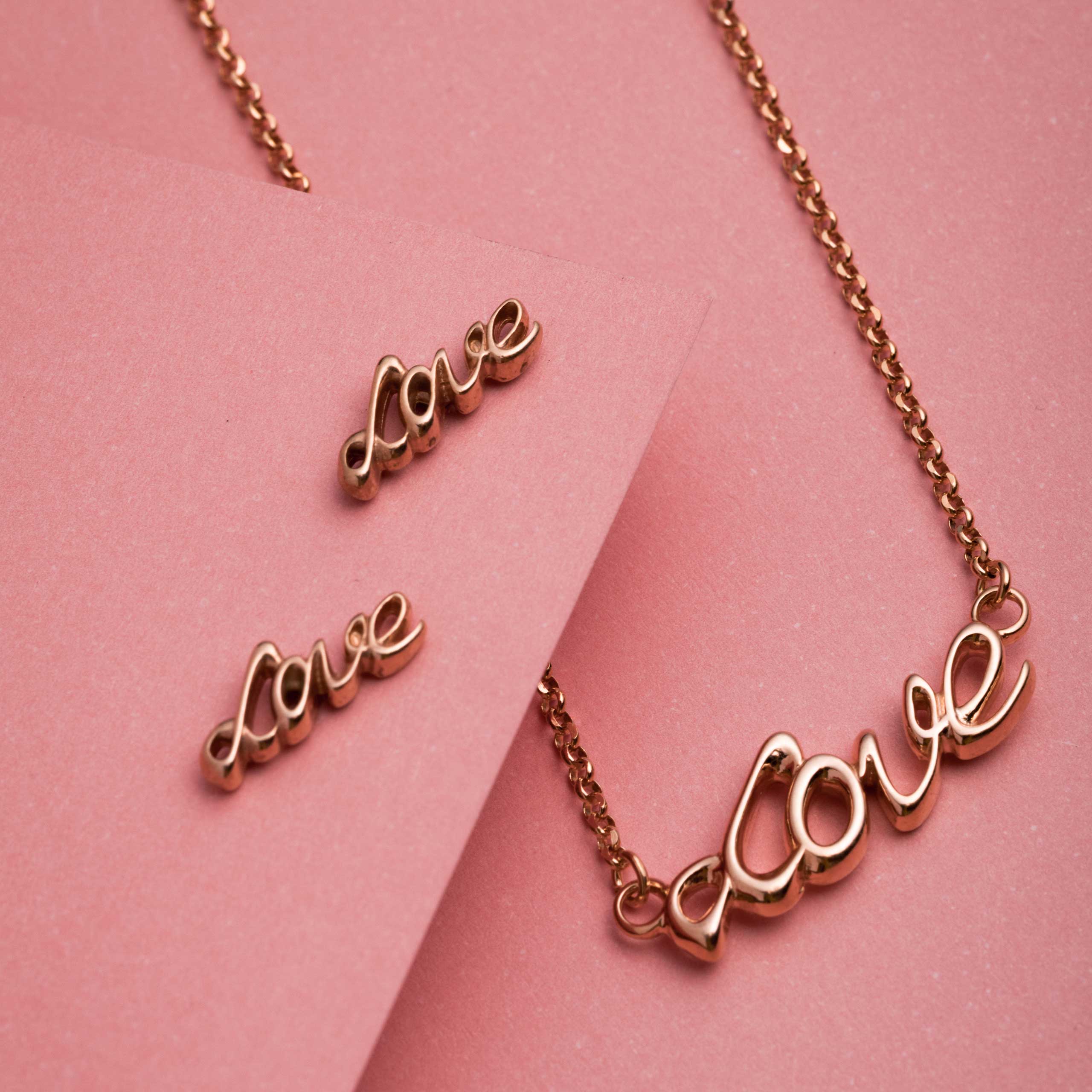 Kolczyki LOVE srebrne pozłacane na różowo